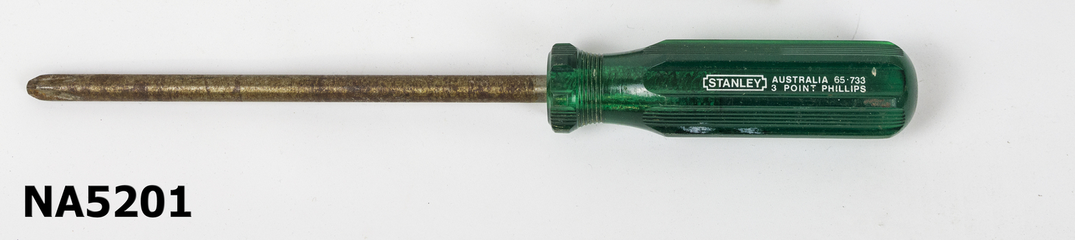 A 3 point Phillips screwdriver with a green handle.