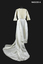 White cotton long wedding dress with train and lace over blouse.