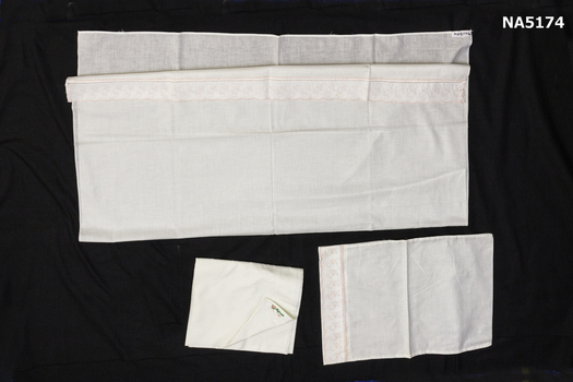 A pair of baby sheets and pillowcase.