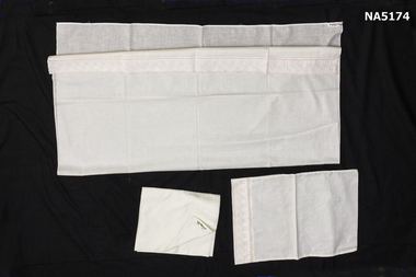 A pair of baby sheets and pillowcase.