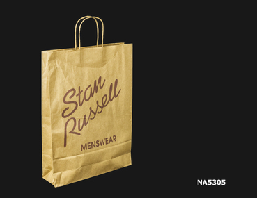 Brown paper bag with string handles.