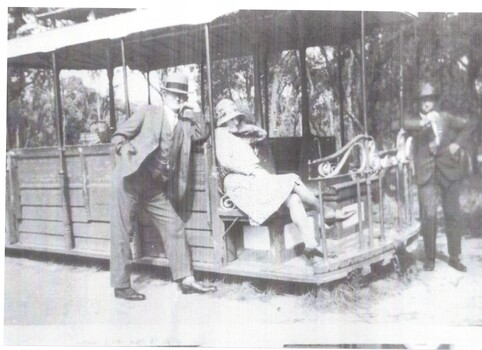 Fels Family having a picnic in Wattle Park sitting on a tram.