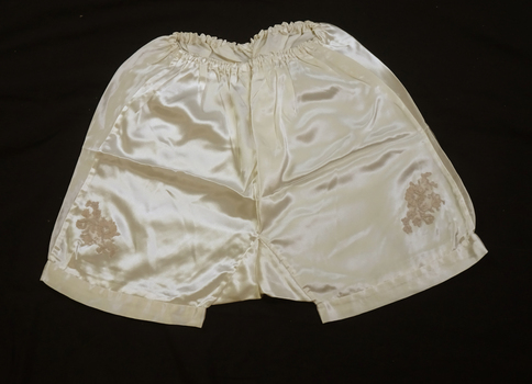 Knickers have appliqued lace floral design on each leg
