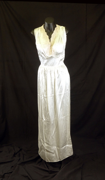 The nightgown is long with a coffee coloured lace Vee front. 
