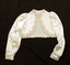 Bedjacket is short with long sleeves and a front fastening with four self-covered buttons. Coffee coloured 