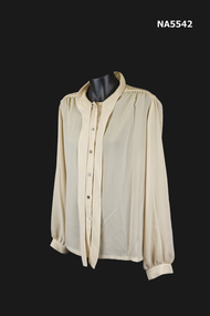 A beige blouse