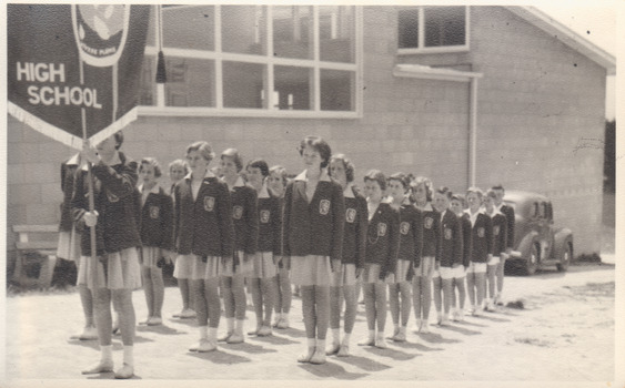 NP4591b Photo of MHS girls behind flag
