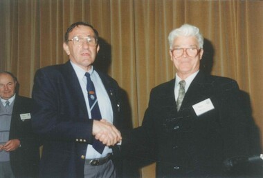 Photograph, Don Gamble Shaking hands with Roger Morrow