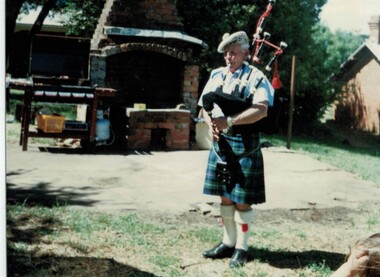 Photograph: Bill Williams with bagpipes - ALP barbeque, November 1997