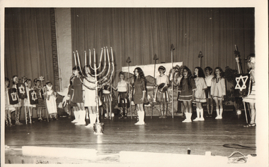 Photograph - Chanukah performance with menorah, c. 1960s, 1960s