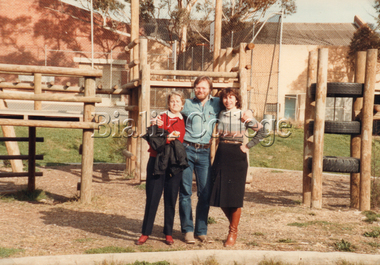Photograph, Staff standing in front of a playground, c. 1980s