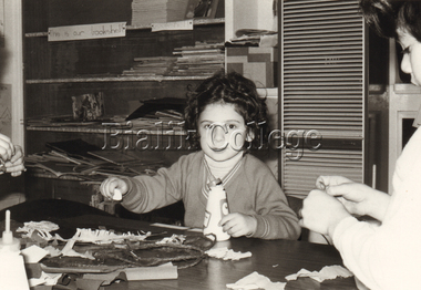 Photograph (Item) - Student doing an art activity, c. 1980s, c. 1980s