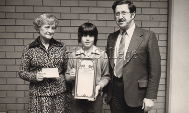 Photograph (Item) - Zosia Mercer and David Goldsmith with a student holding a certificate, c. 1980s
