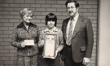 Photograph (Item) - Zosia Mercer and David Goldsmith with a student holding a certificate, c. 1980s