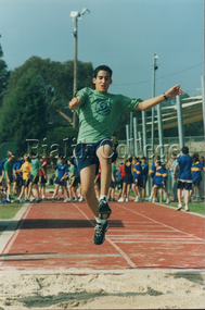 Photograph, Student competing in the long jump at a House Sports Day, c. 2000s, c. 2000s