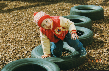 Photograph (Item) - A student from Kinder class 3A playing outside, c. 1990s