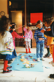 Photograph (Item) - ELC students playing a fishing game, c. 1990s