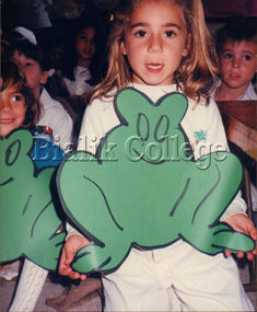 Photograph, Student holding large frog cut-out, Pesach, 1989