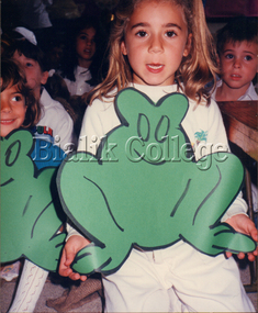 Photograph, Student holding large frog cut-out, Pesach, 1989, 1989