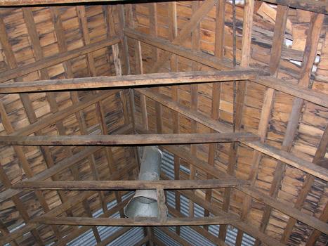A timber roof inside a weatherboard church