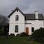 Double storey house with slate roof. 