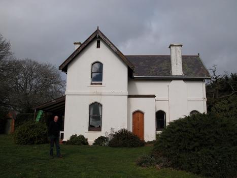 Double storey house with slate roof. 