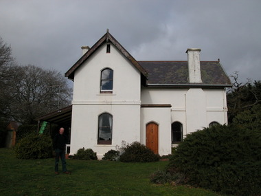 Double storey house with slate roof. 