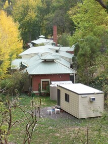 A container and brick buildings in the Hepburn Springs Reserve