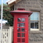 Phone box in front of a bluestone post office