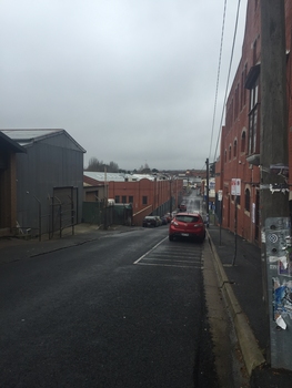 A street lined with red brick buildings