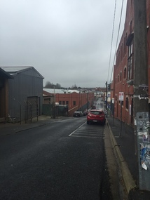 A street lined with red brick buildings