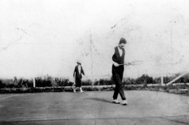Two people play tennis