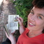 A Woman holds a book with two old holy cards