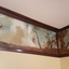 A painted frieze on a cottage wall