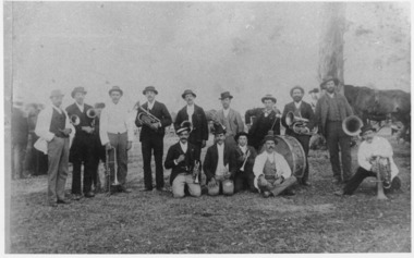 A naumber of men with brass band instruments