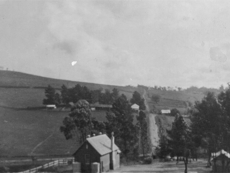 A landscape with a road from the foreground to the horizon