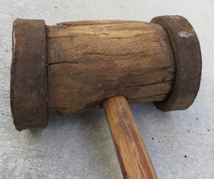 Steel rimmed wooden mallet