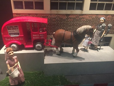 Photograph of Myer Christmas window showing a horse drawn Tip Top bread van and a woman holding bread in a basket