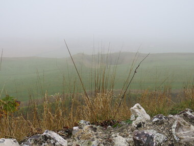 Photograph - Colour, looking from Stonework towards earth mounds, Old Sarum, England, English Heritage Site, 2016, 01 November 2016