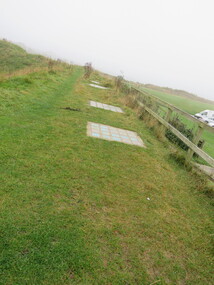 Photograph - Colour, Public toilets hidden in earth mound, Old Sarum, England, English Heritage Site, 2016, 01 November 2016