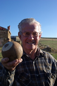 Photograph - Colour, Clare Gervasoni, Maurie Gervasoni holds a wooden bocce ball at Yandoit Creek, 2016, 2016