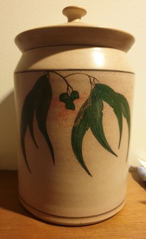 Lidded ceramic pot with glazed gum leaves