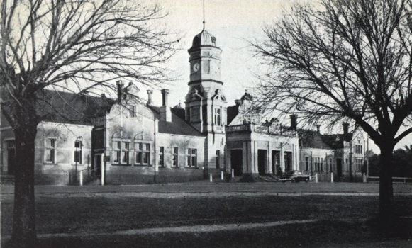 A grand railway station with tower