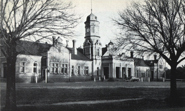 A grand railway station with tower