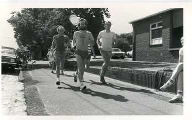 men running along a footpath