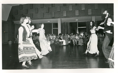 A number of people dancing