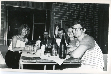 A table of people at a colonial dance