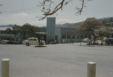 The Commonwealth Bank on the corner with policeman directing traffic in centre of road.