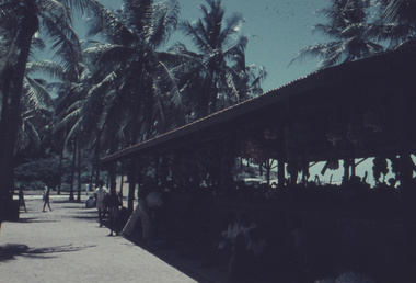 Koki markets showing palm trees in background and Papuans selling produce.