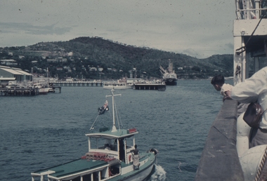The MV Bulolo coming into Port Moresby Wharf 1958. The tug is in the foreground.